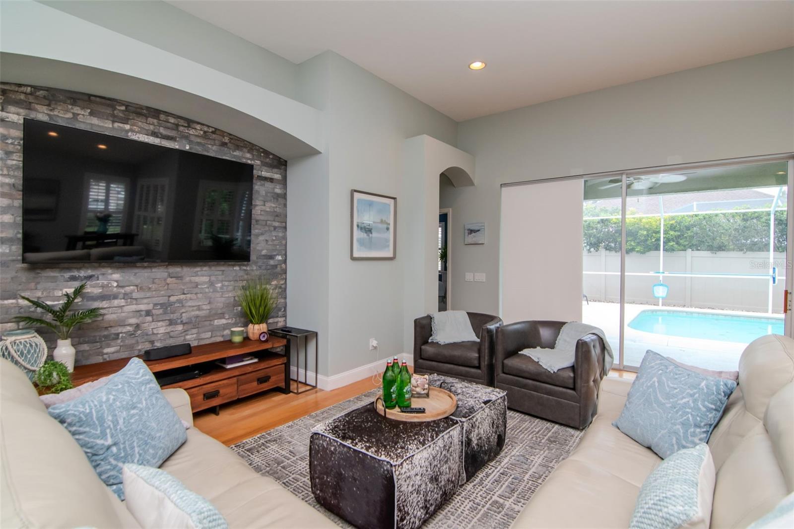Family room overlooks the pool and lanai