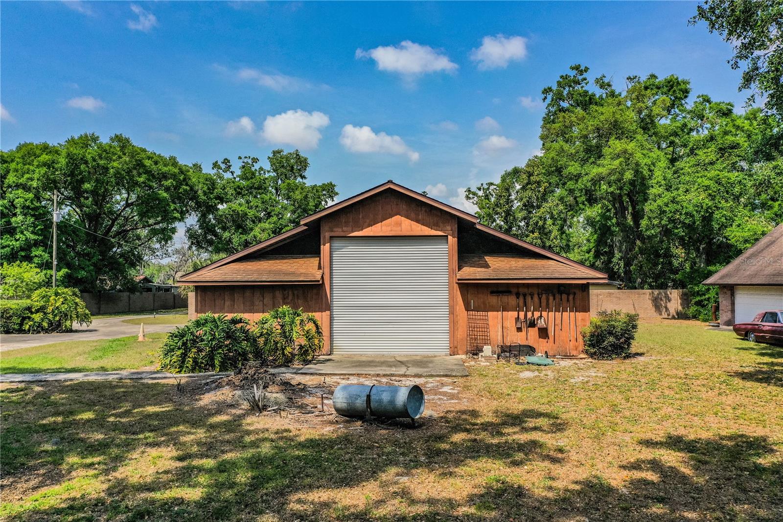 Workshop has a 15' overhead door and adjacent 2 car garage plus an apartment with bathroom