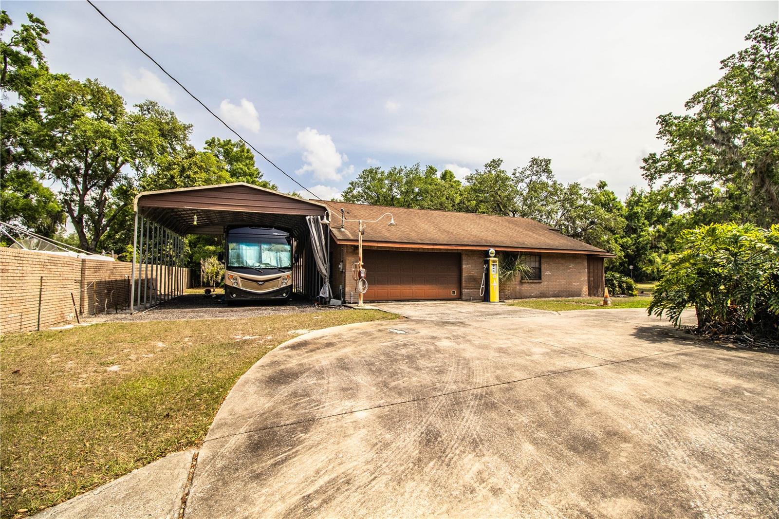 2 car garage with adjacent RV carport