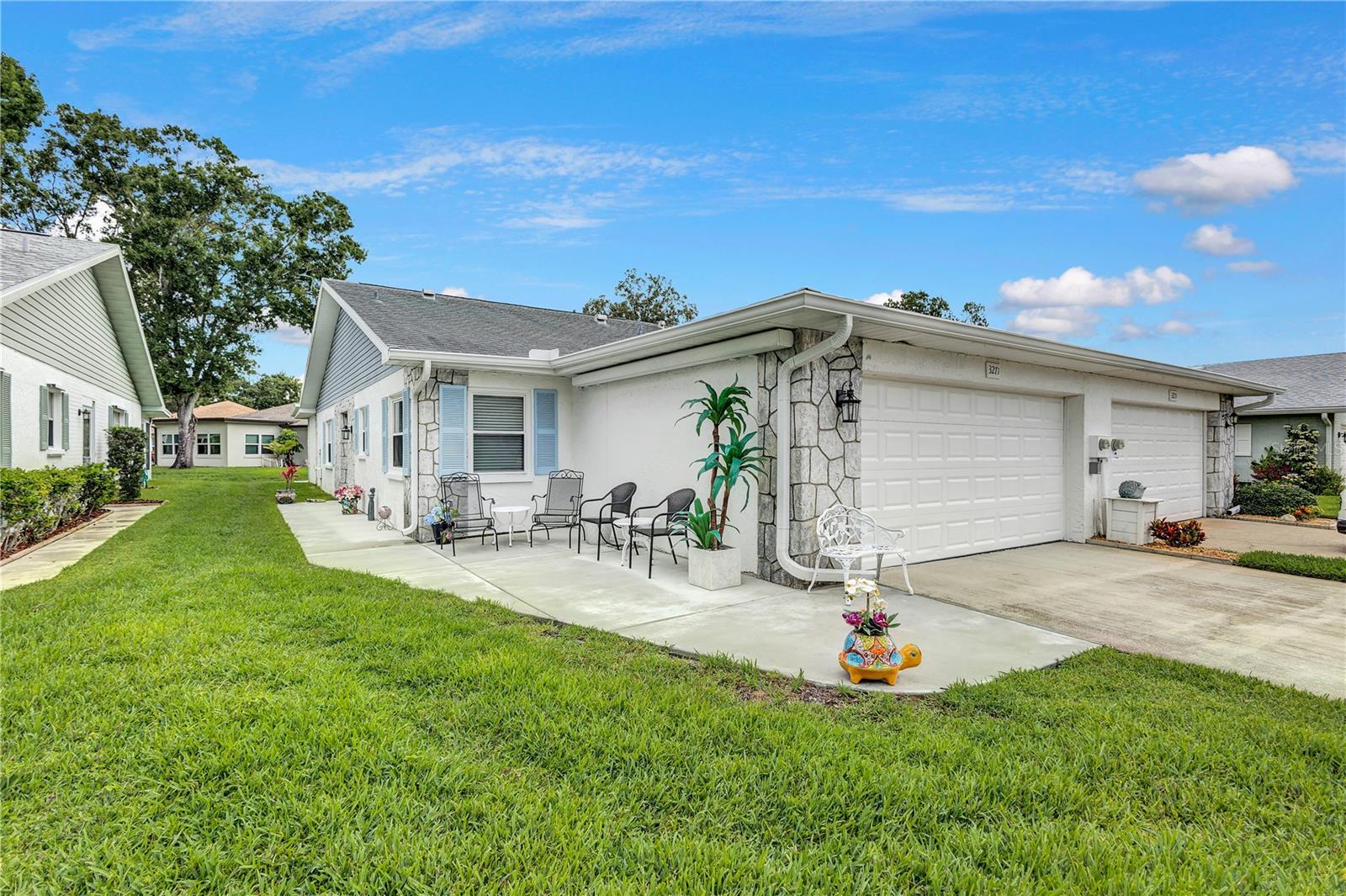 2 car garage with patio that has a retractable awning which you will see in following pictures