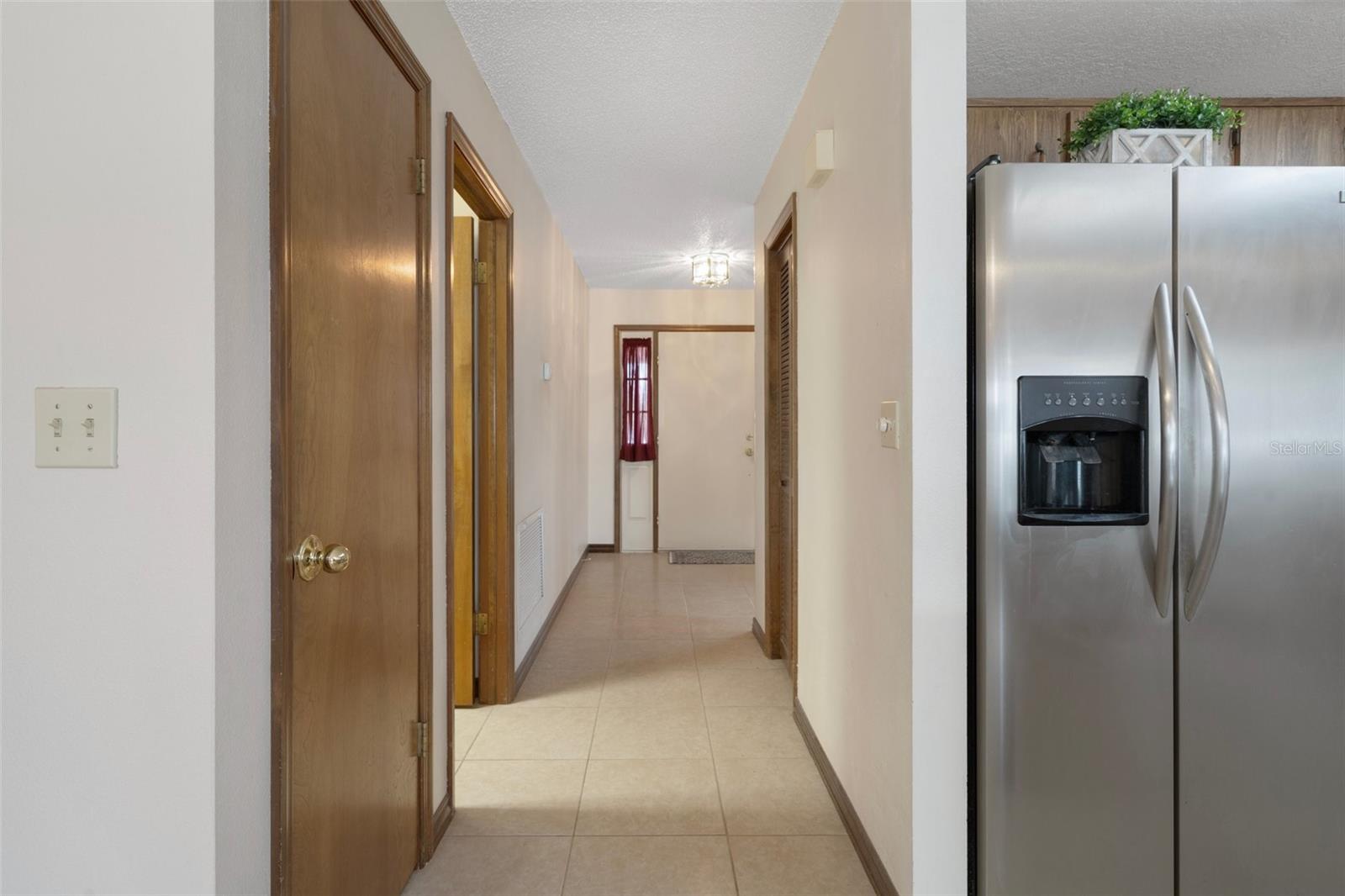 Hallway to the laundry room on the left