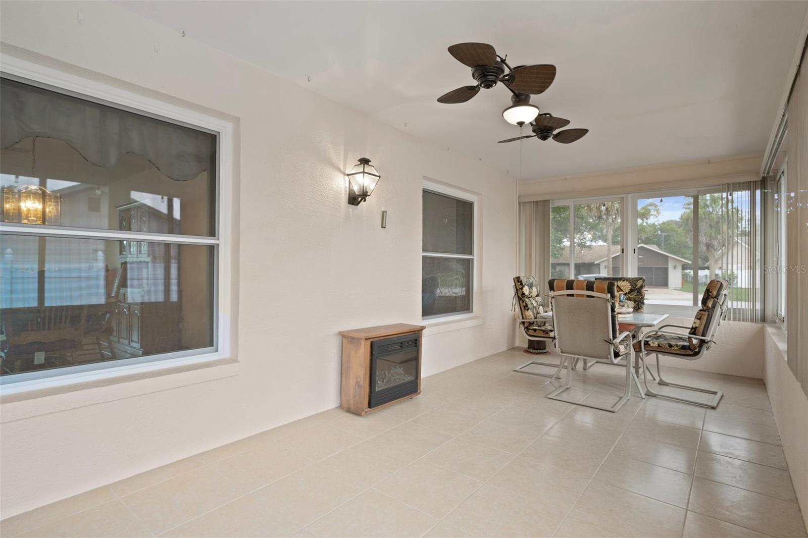 Enclosed Porch with gorgeous ceramic tile flooring