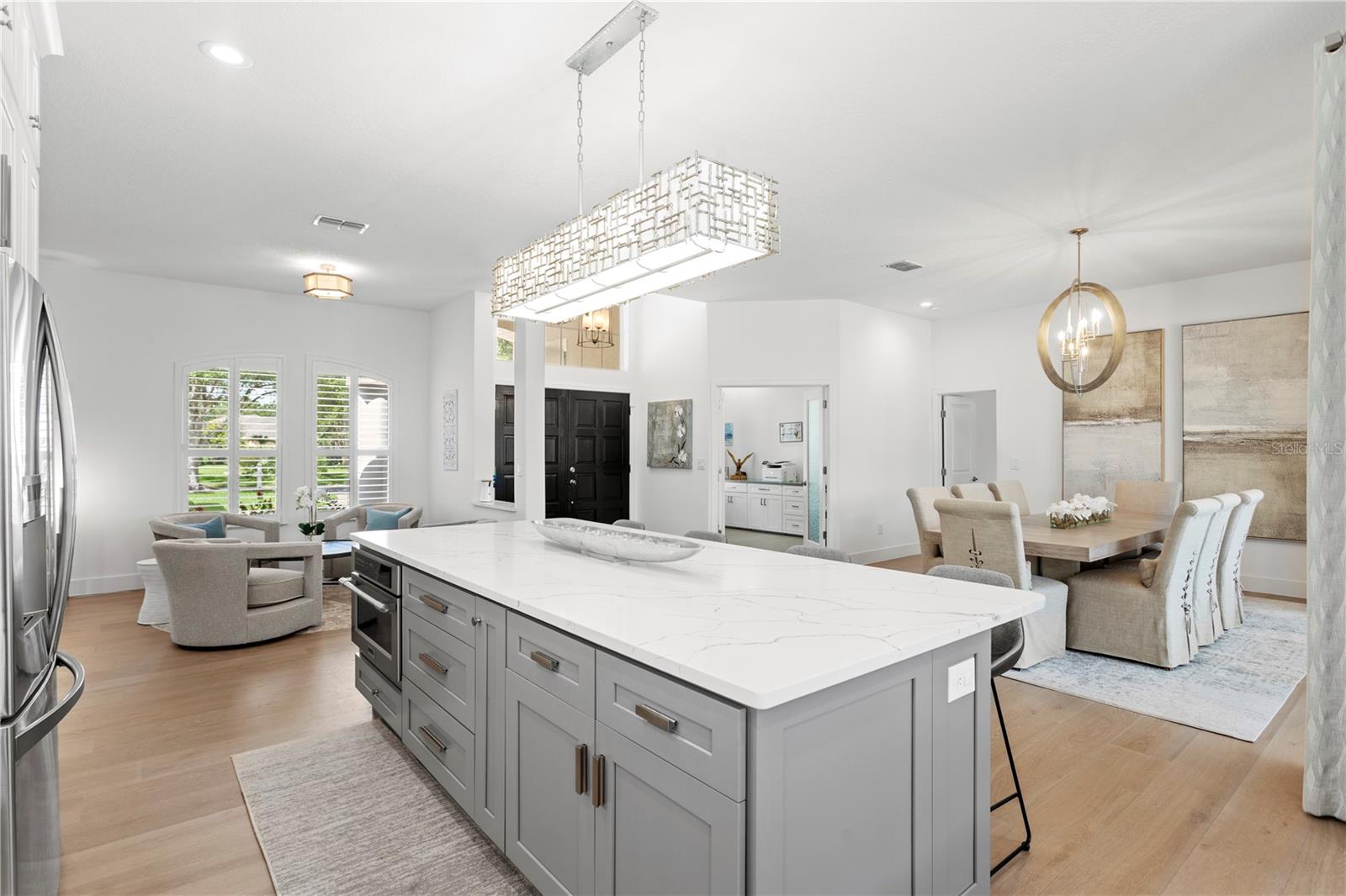 Enjoy open sightlines from the kitchen to the living and dining areas.