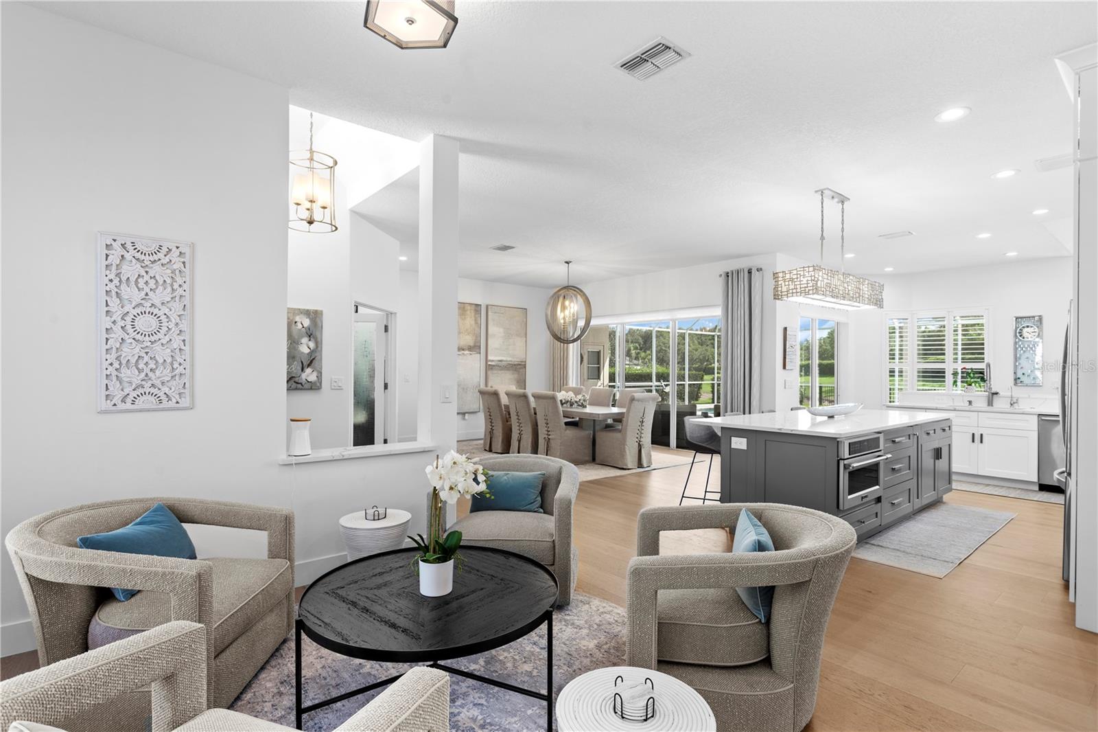 Whether you're curling up with a good book or enjoying conversation over coffee, this light-filled living room offers comfort and connection to the rest of the home.