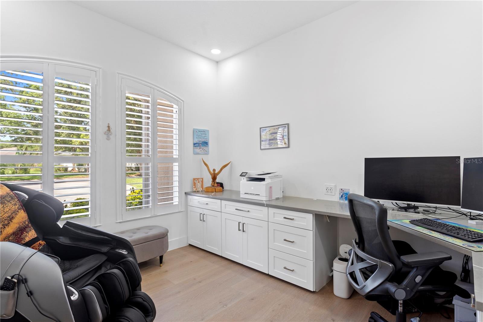 Featuring a wraparound built-in desk, this private den adds extra functionality to the home - ideal for working from home or creative projects.