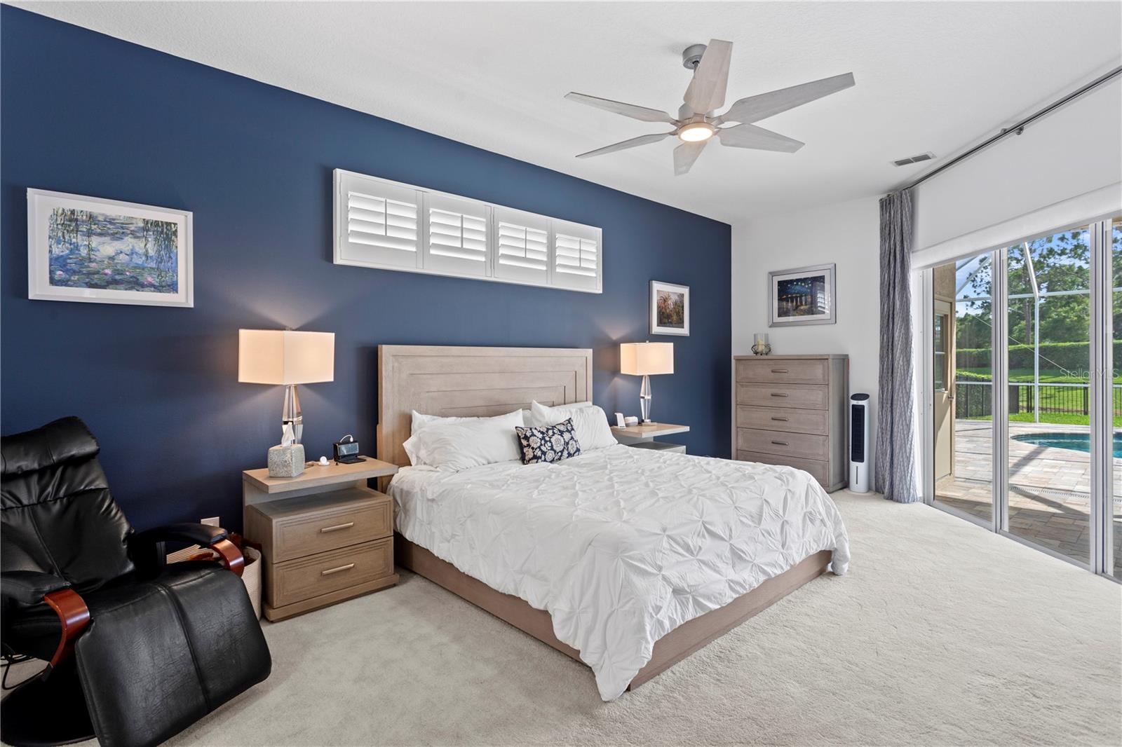 The spacious primary suite offers a quiet retreat, tucked away for added privacy and comfort.