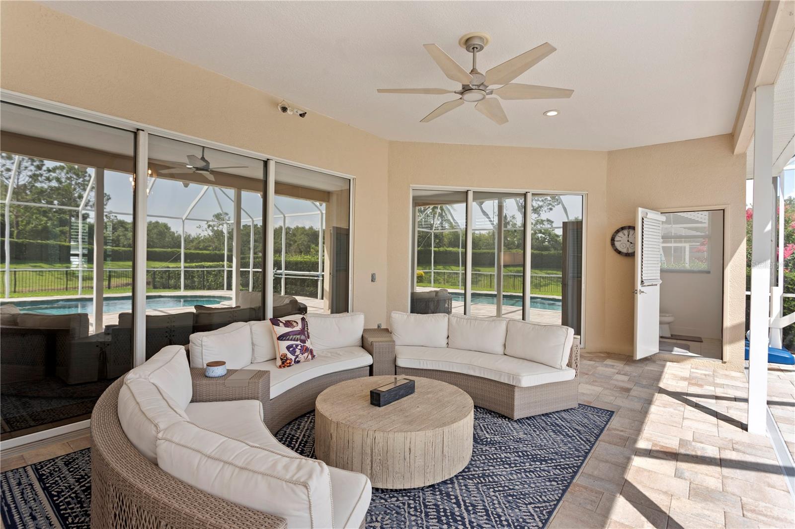 Enjoy flexible outdoor living just steps from your sparkling pool.