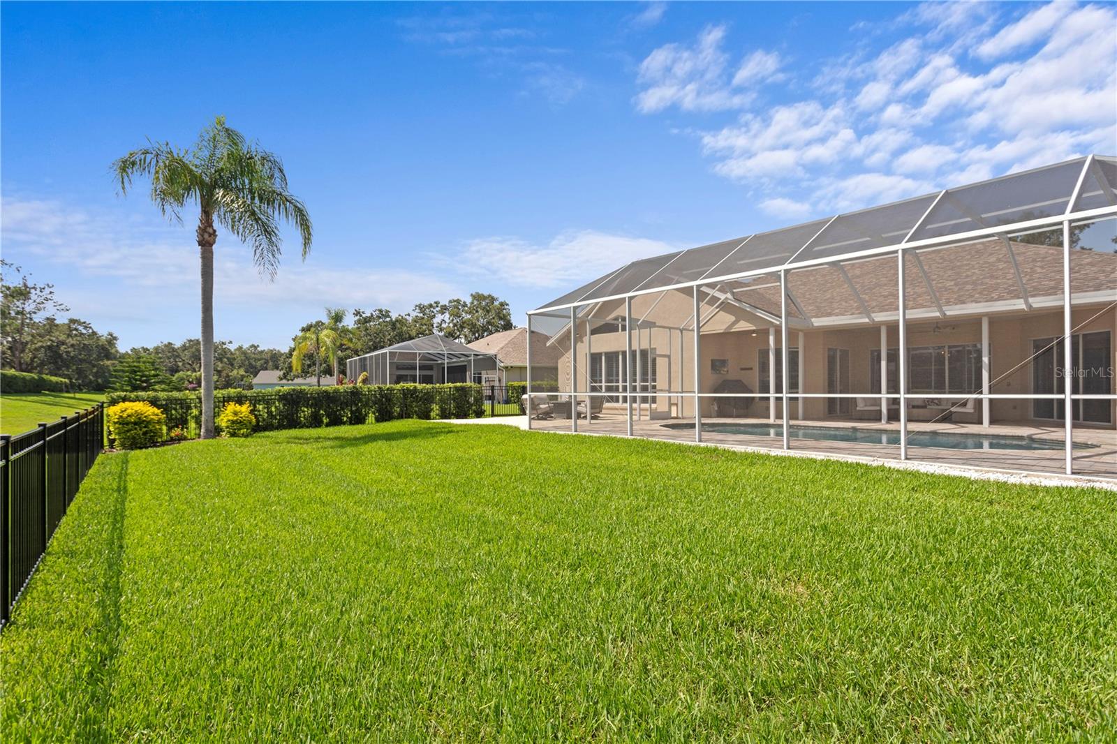 The spacious backyard is completely fenced in.