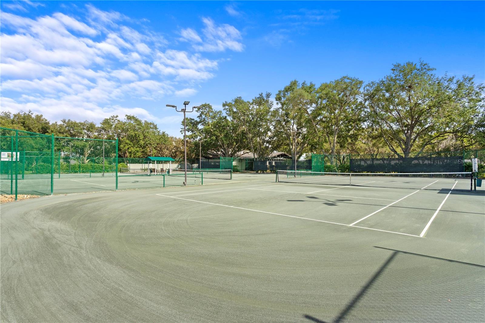 Lighted Har-Tru clay tennis courts are available with a tennis membership.