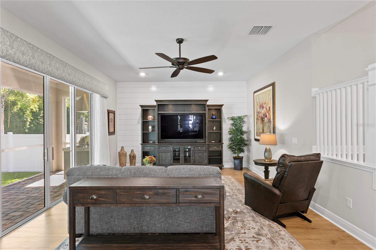 Room for everyone - and then some! This family room opens right up to the lanai and lush backyard.