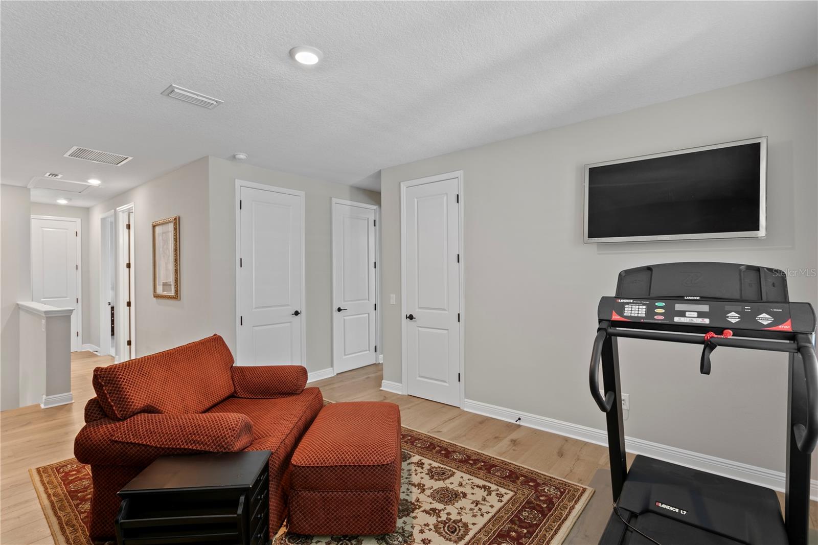The open and airy loft is complete with a large storage closet.