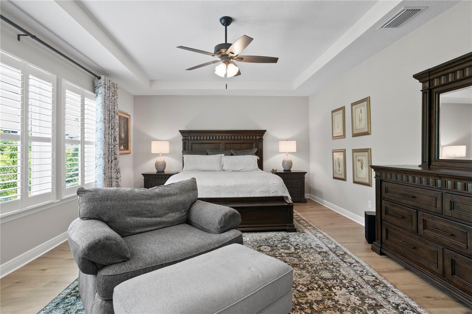 Serene and spacious with trey ceilings and a wall of windows.