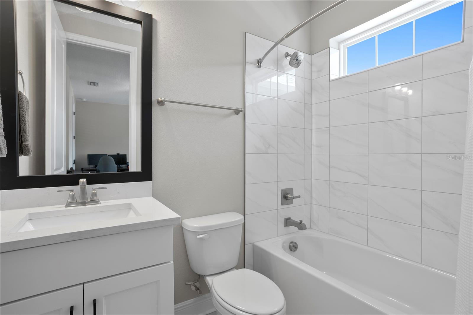 This large bedroom features a private bathroom.