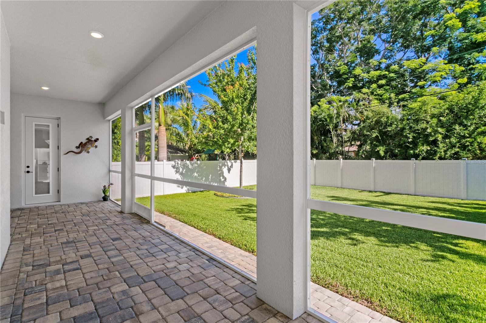The screened in porch is a perfect spot to enjoy your private backyard.