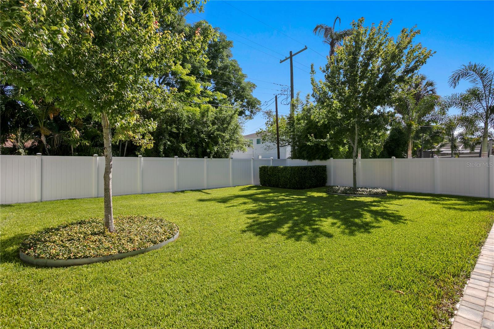 The expansive, fully fenced backyard offers endless possibilities - ideal for a future pool, outdoor living space with a fire pit or simply a perfect spot for pets to play and roam freely.