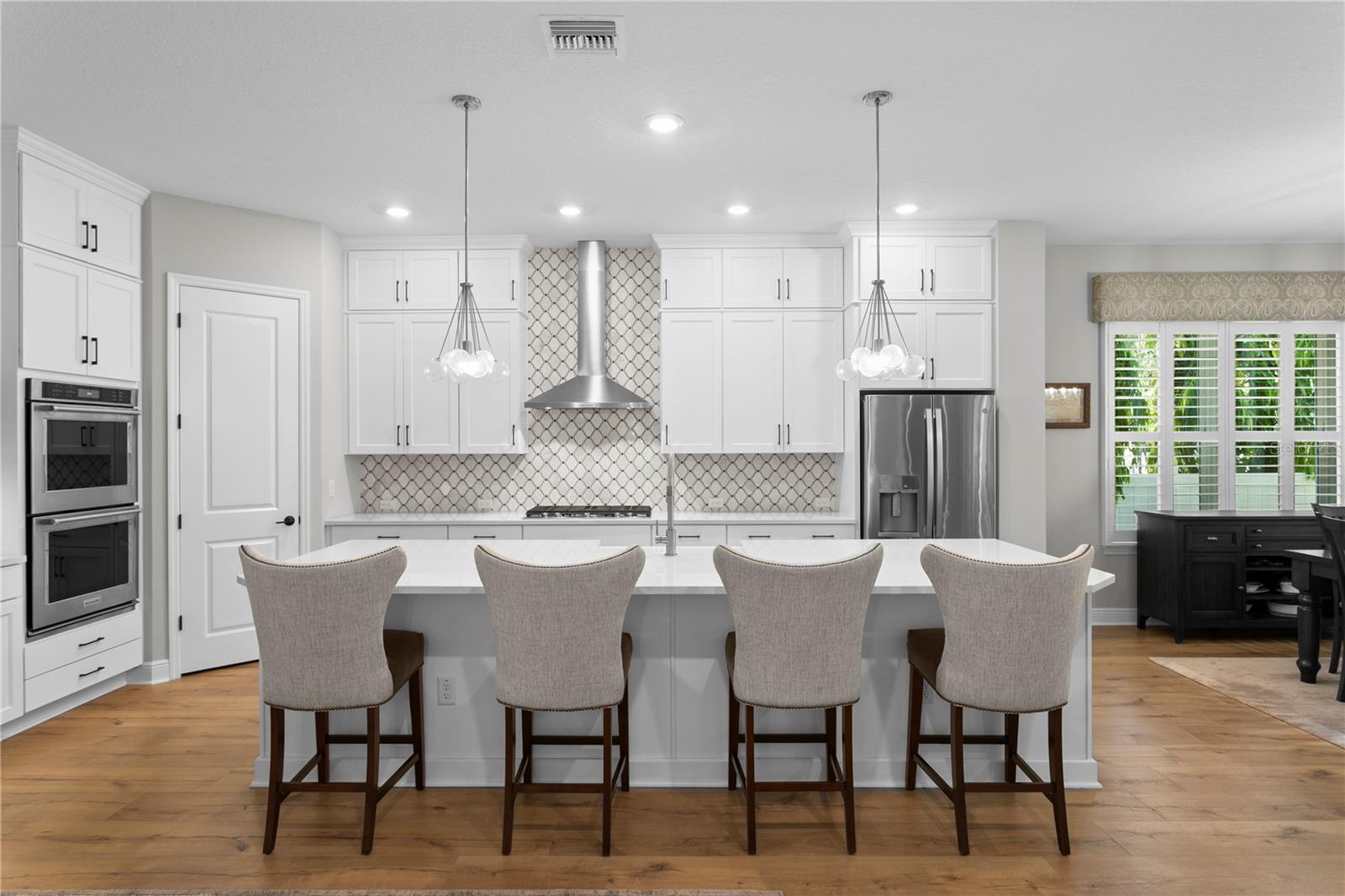 Beautiful custom cabinets reach the ceiling, taking full advantage of the space.
