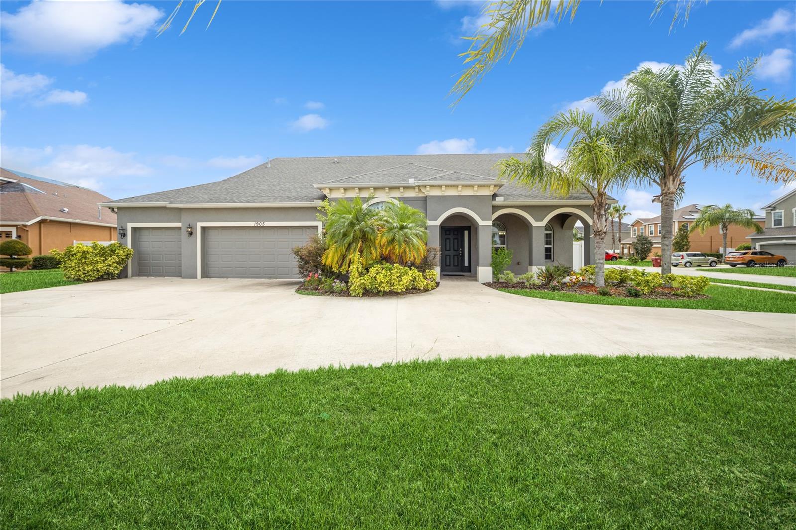 Front elevation with inviting entryway and arched detail
