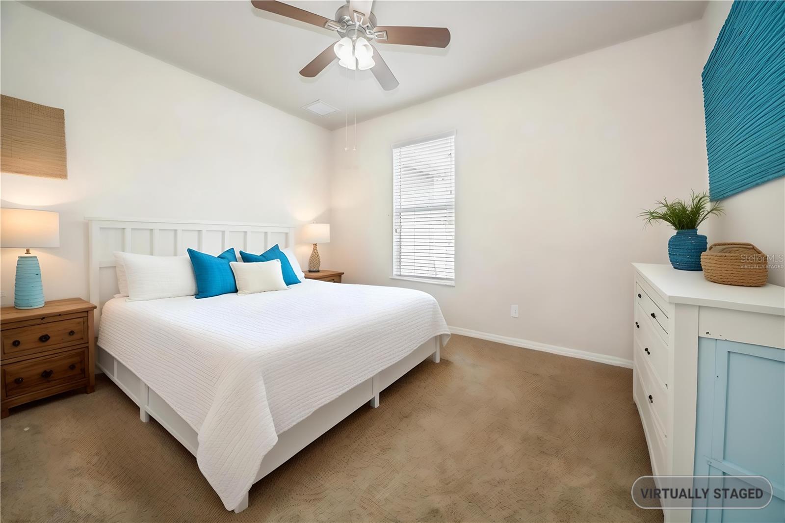 Virtually staged to demonstrate a functional bedroom or guest space.