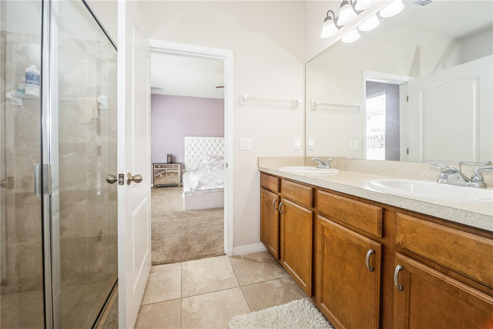 En suite bathroom with walk-in shower and double vanity