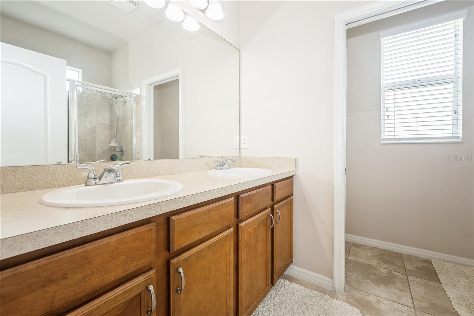 Bathroom with oversized vanity and abundant lighting