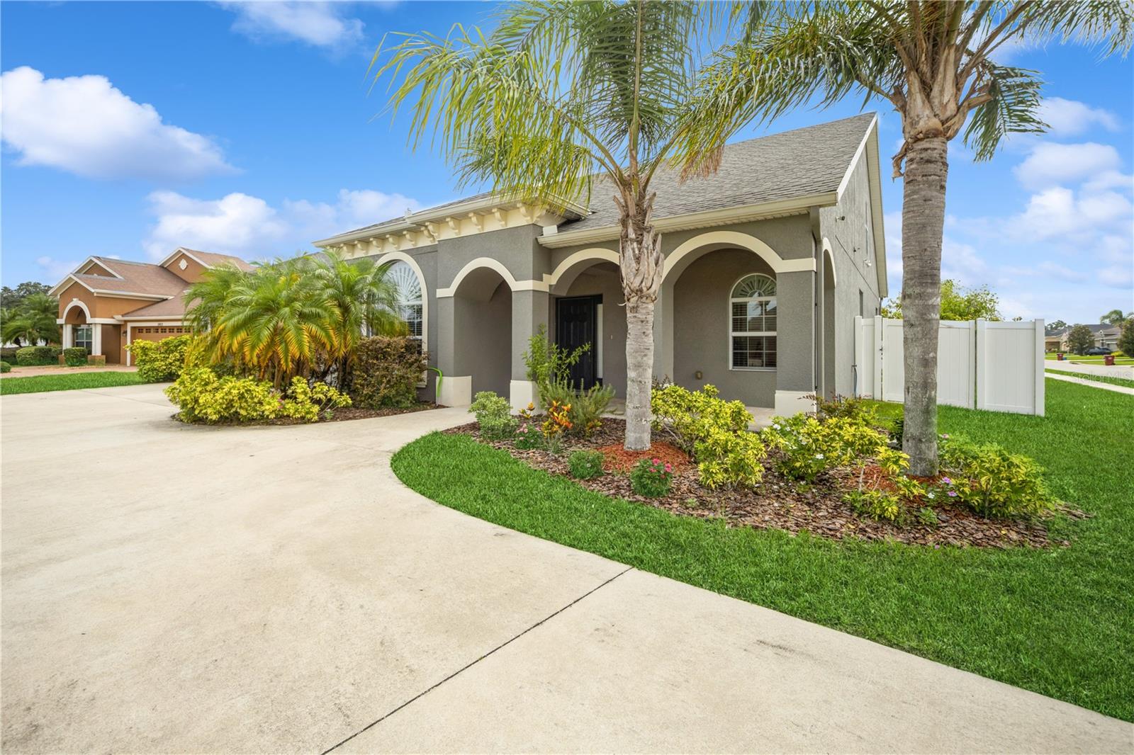 Circular driveway and well-maintained landscaping in front yard