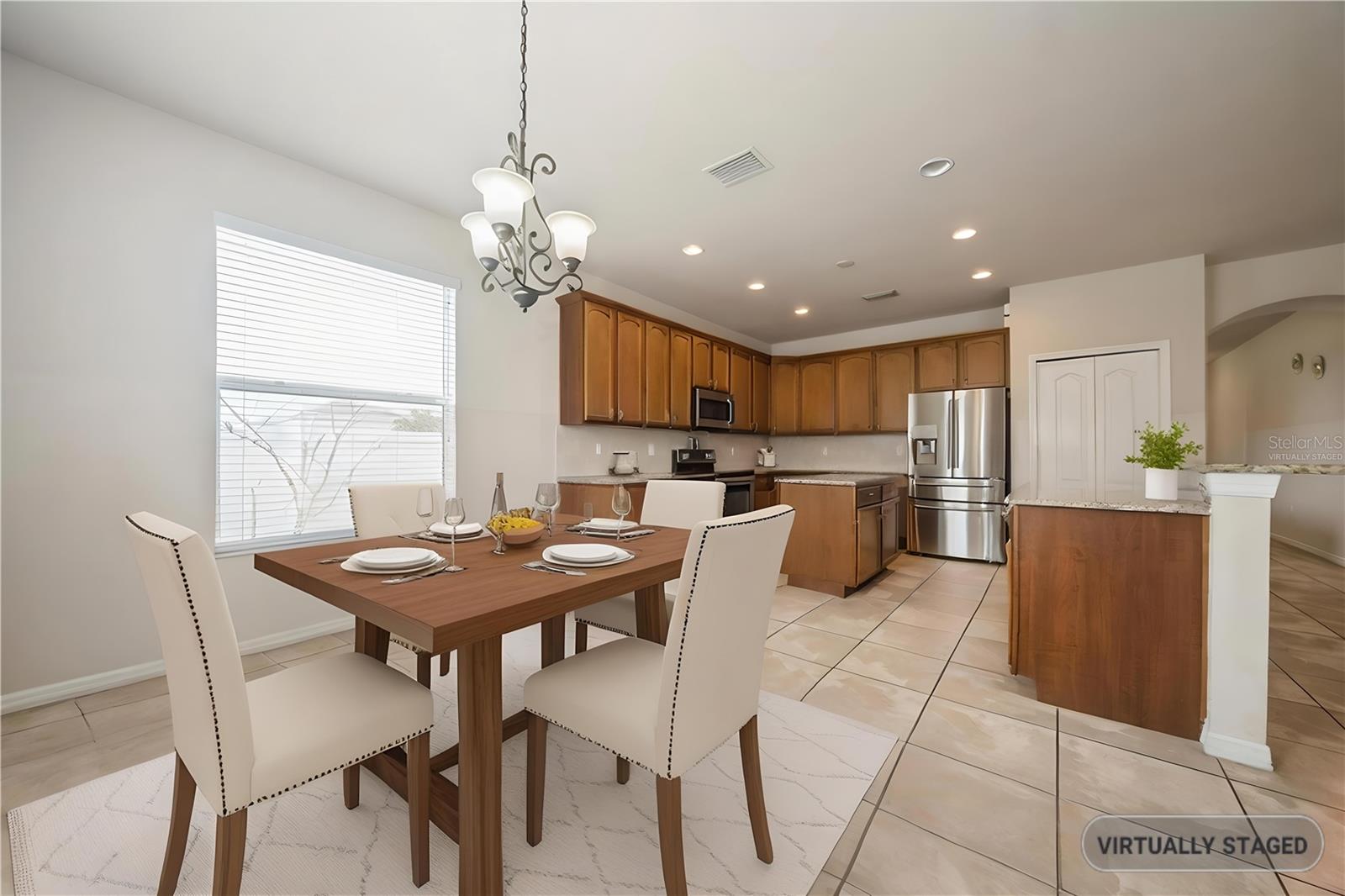 Virtually staged dining room showcasing layout potential for entertaining.