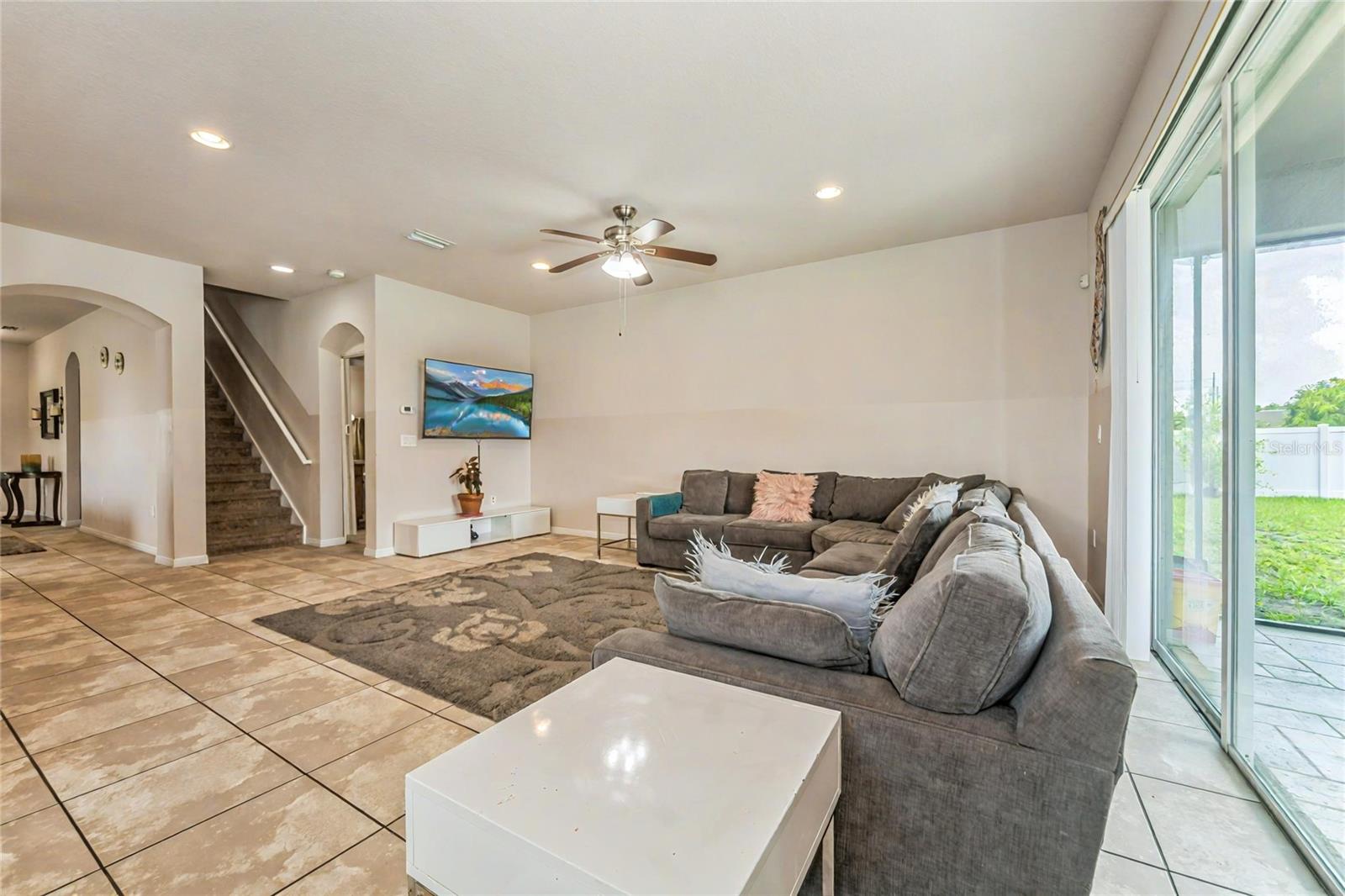 Open concept living area with access to backyard