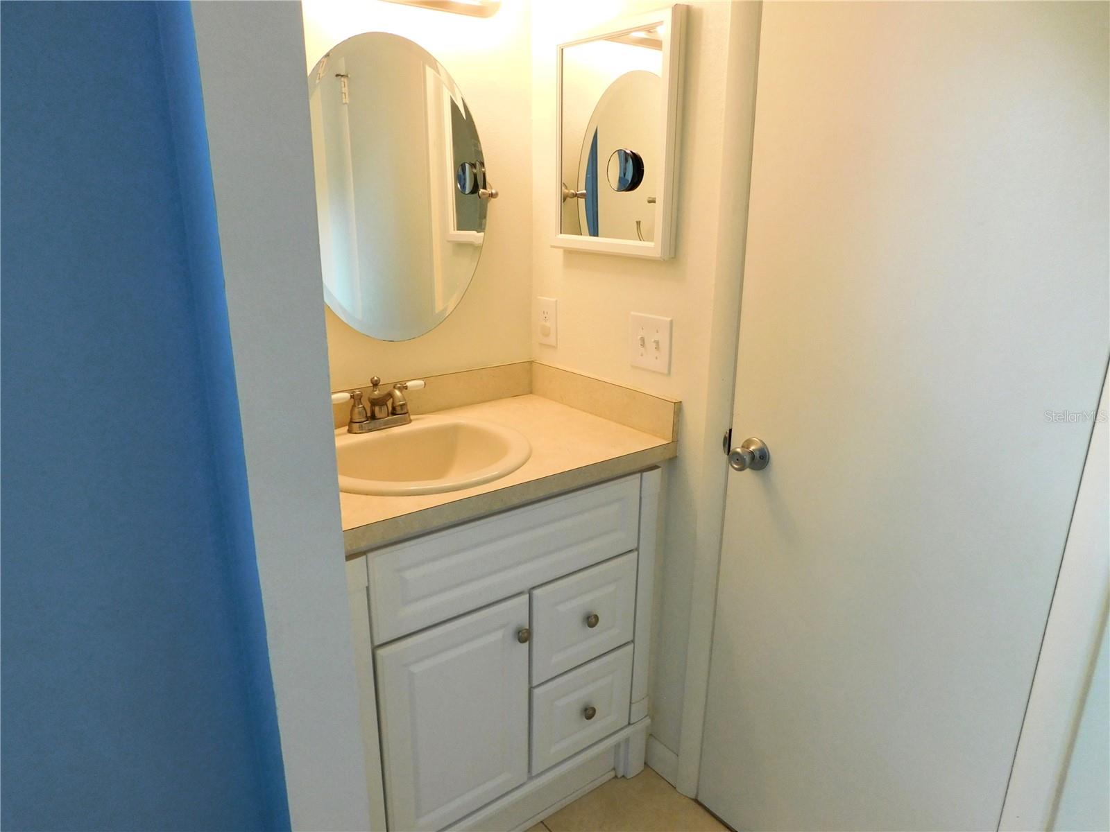 Separated vanities in Guest Bathroom