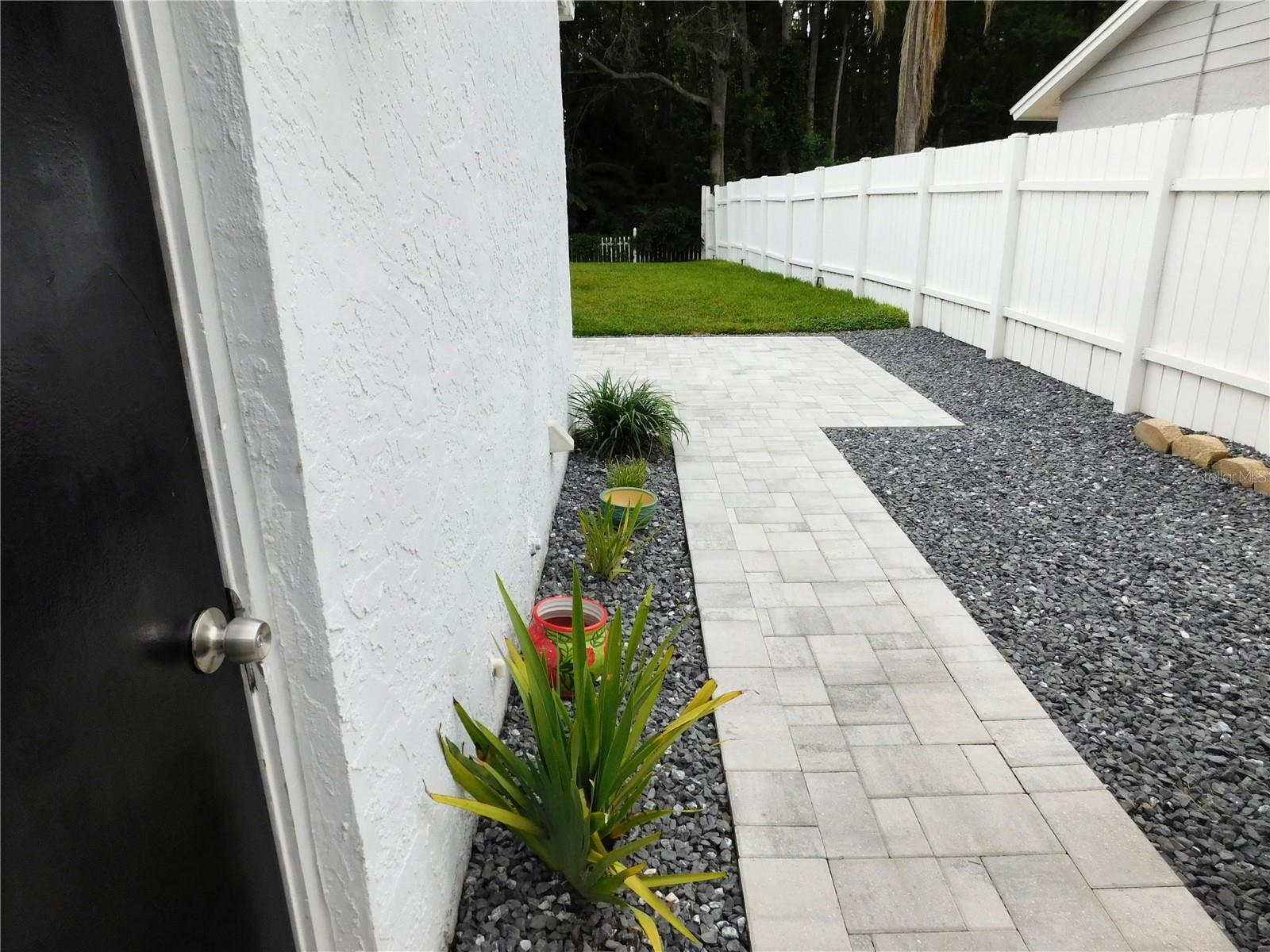 Side door from laundry room to left side of yard