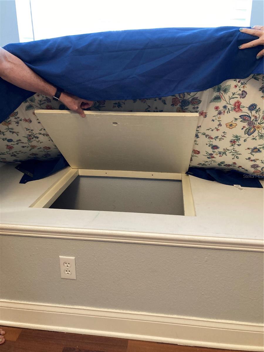 storage under window seat in bedroom 2