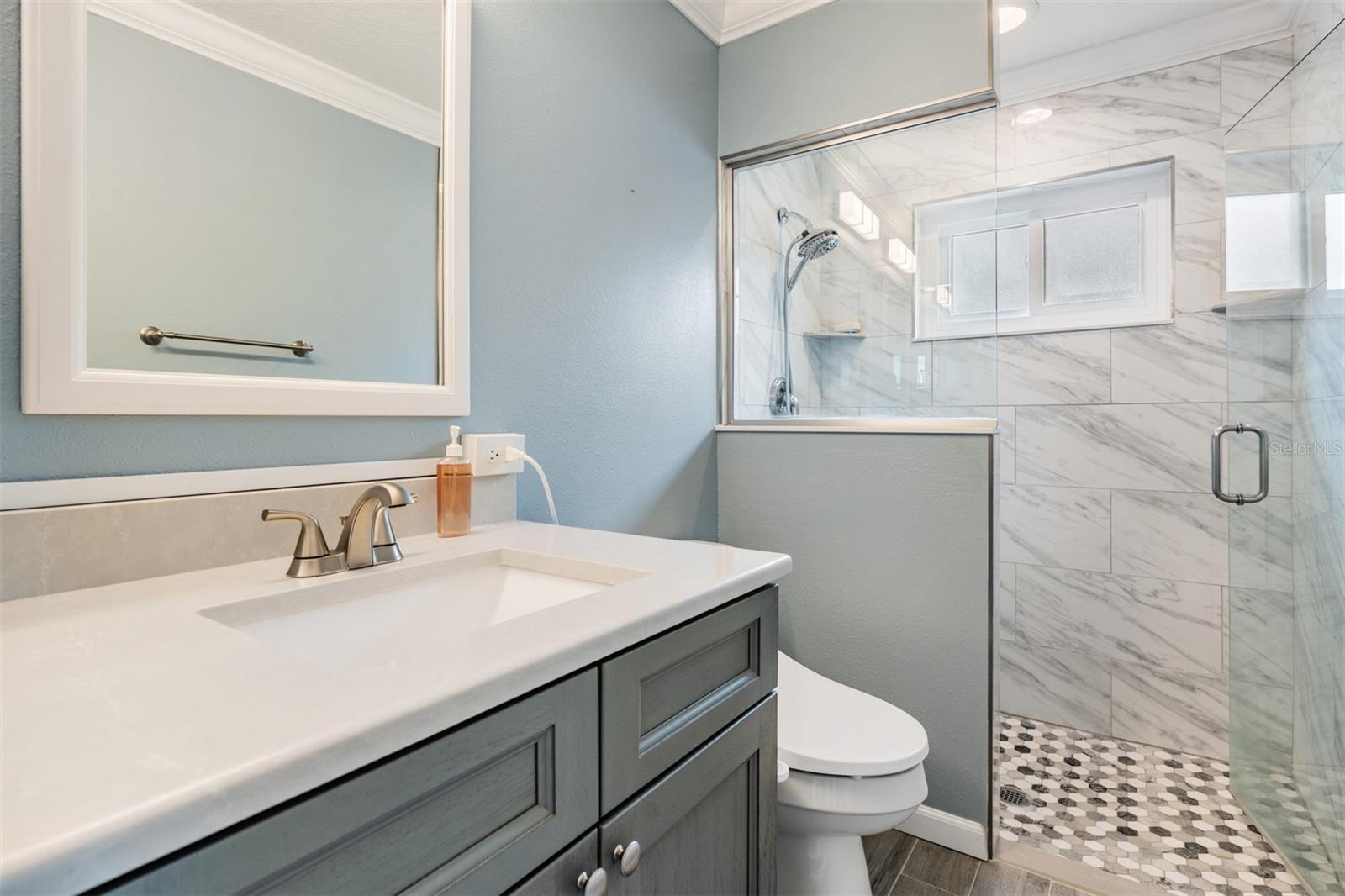 Sleek and well done updated bath!