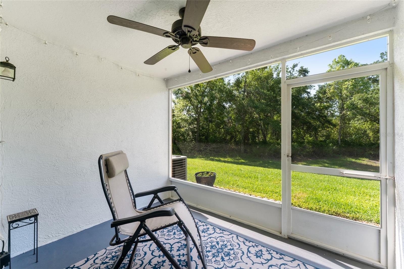 Enjoy the sights & sounds of nature from your south facing screened porch