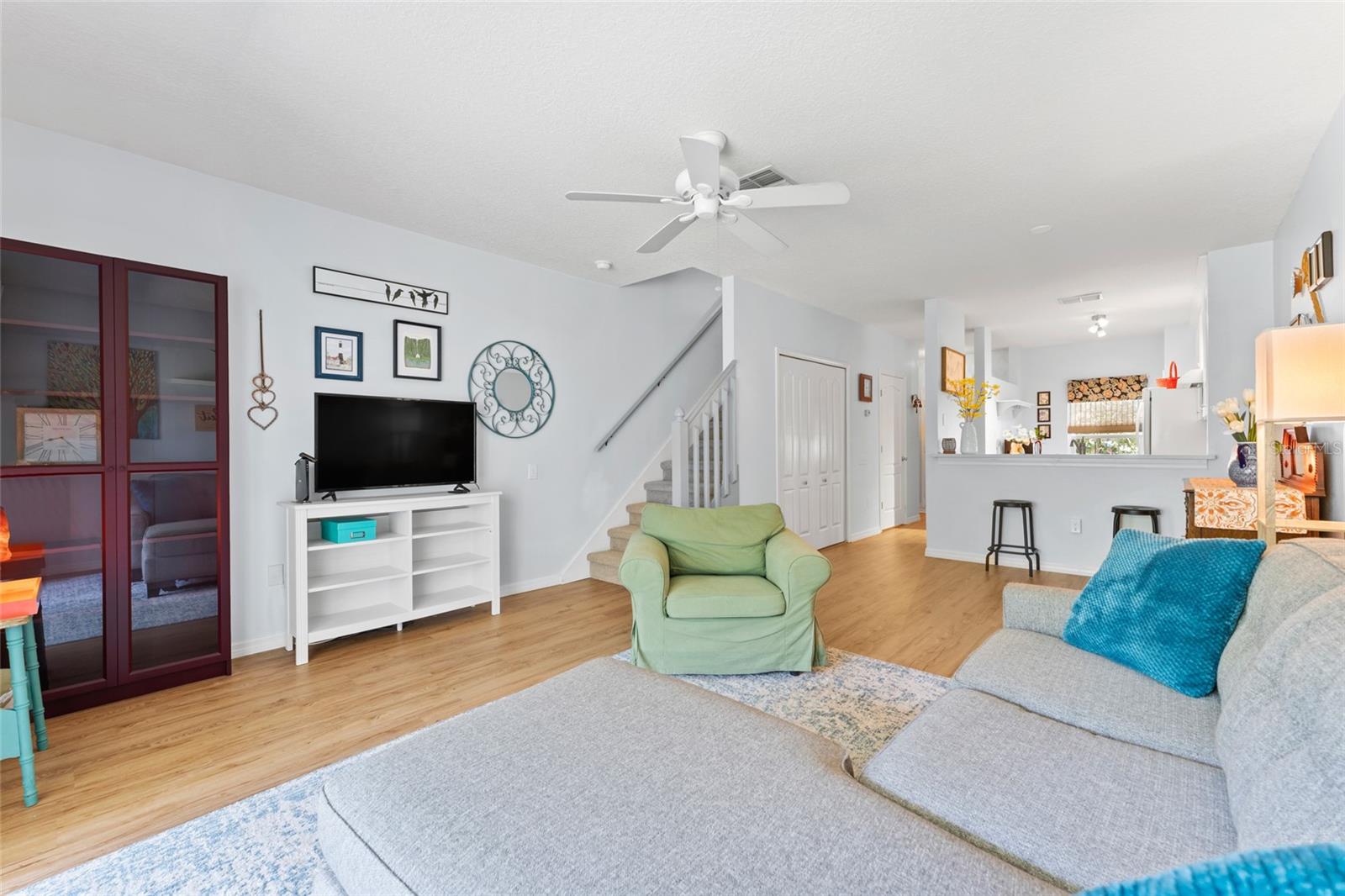 Open floor plan; breakfast bar to kitchen; Laundry closet is beneath stairs