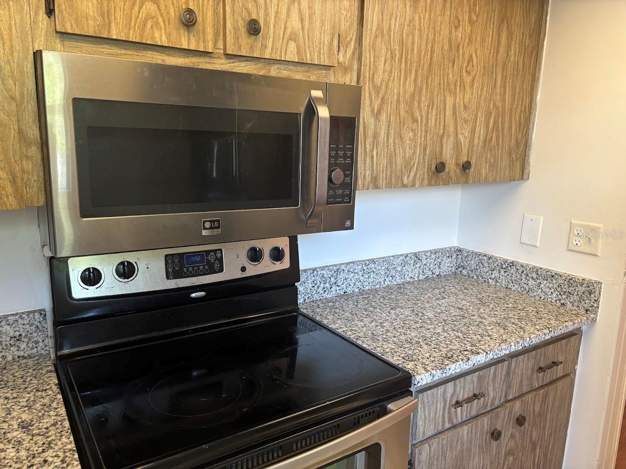 Microwave and range in kitchen