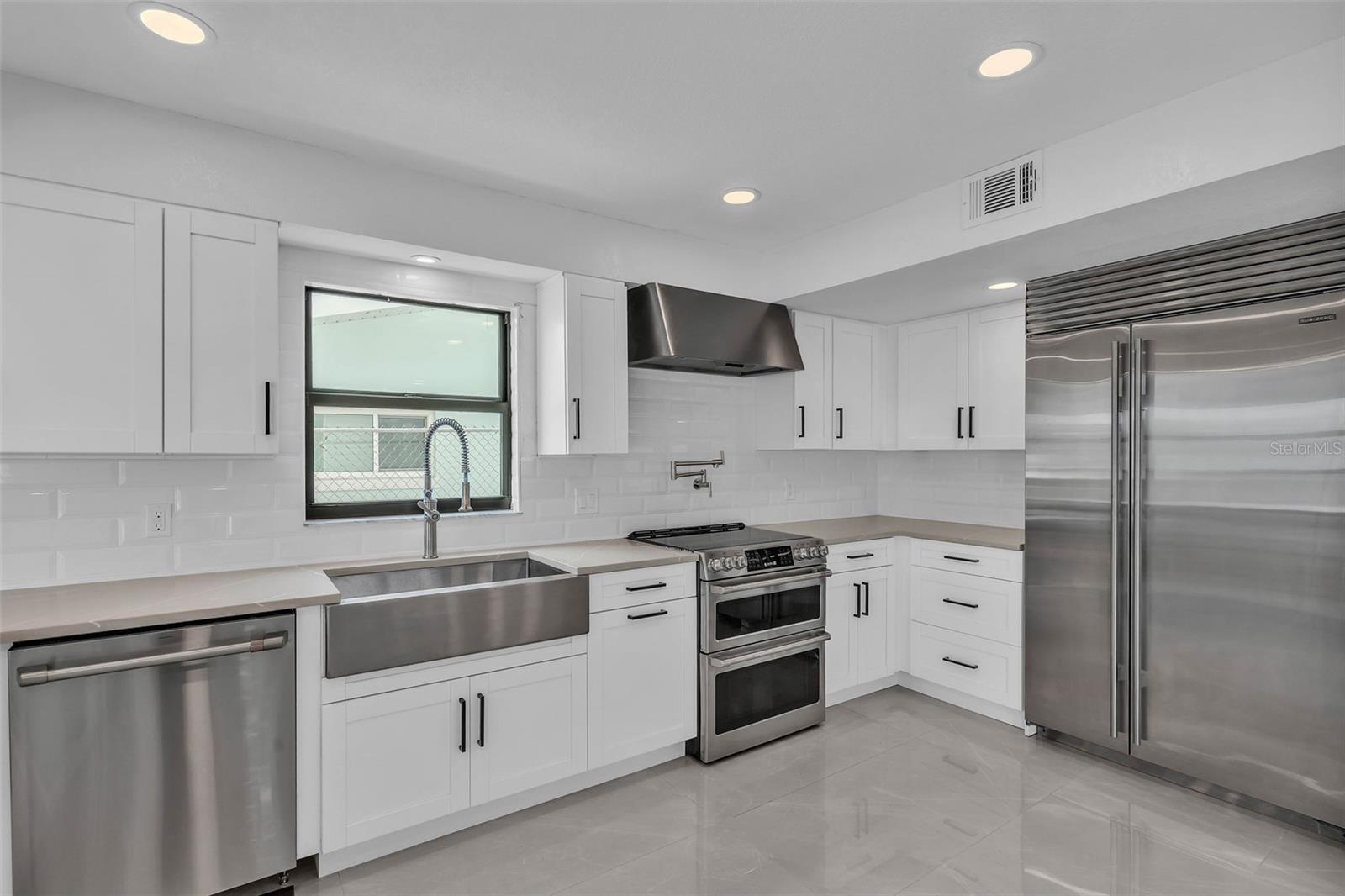 Farm House sink, Double oven and Large Refrigerator welcome you to entertain,.