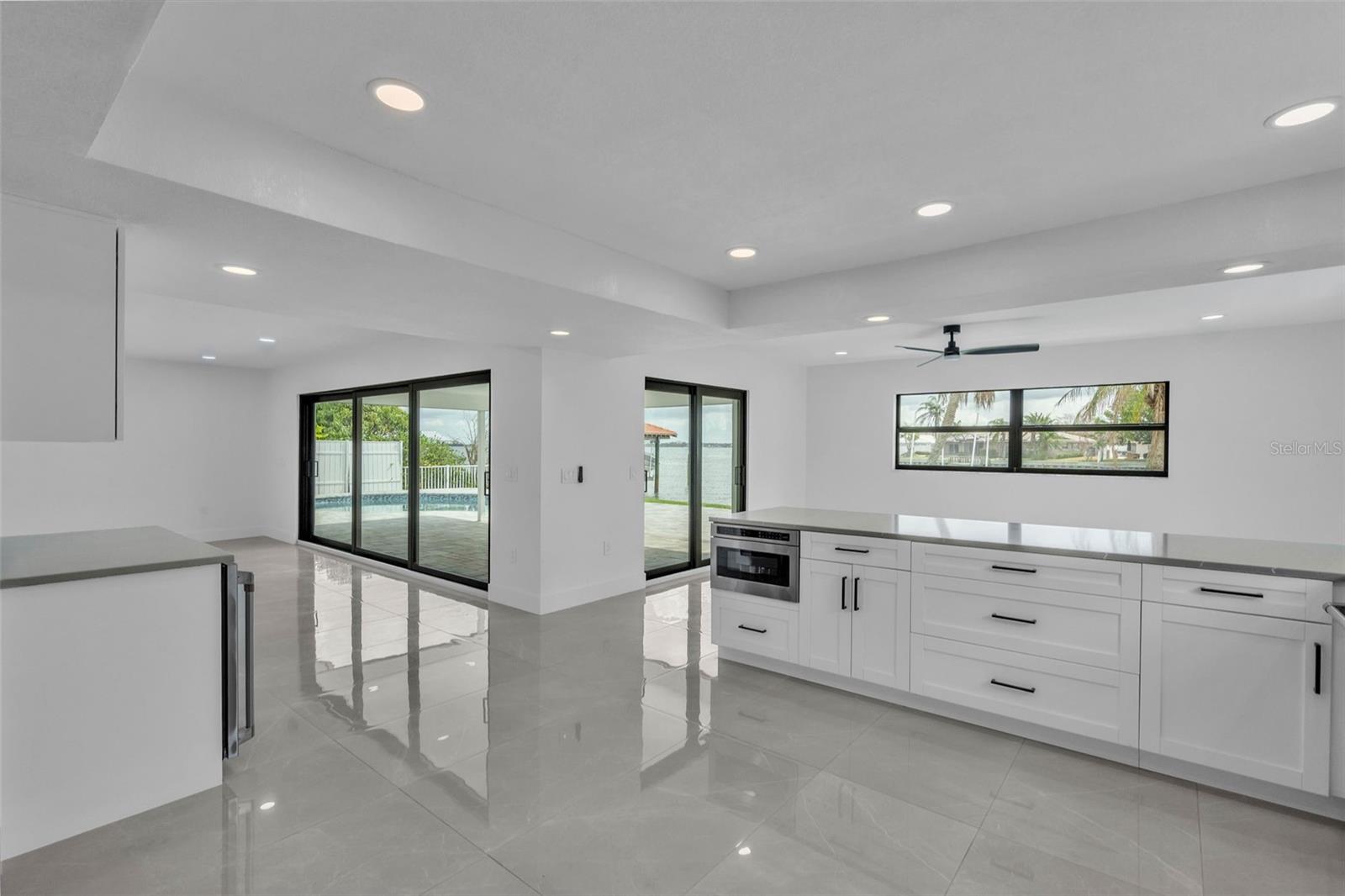 Your new home has beautiful cabinets , flooring and lots of light in the kitchen area