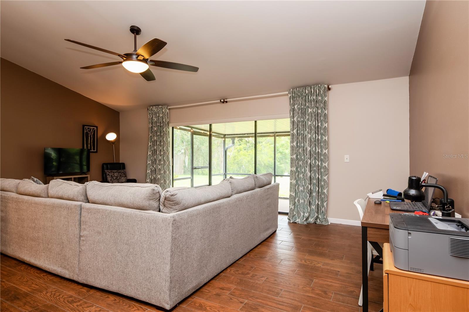 Open Living Space with panoramic views of pond and large backyard