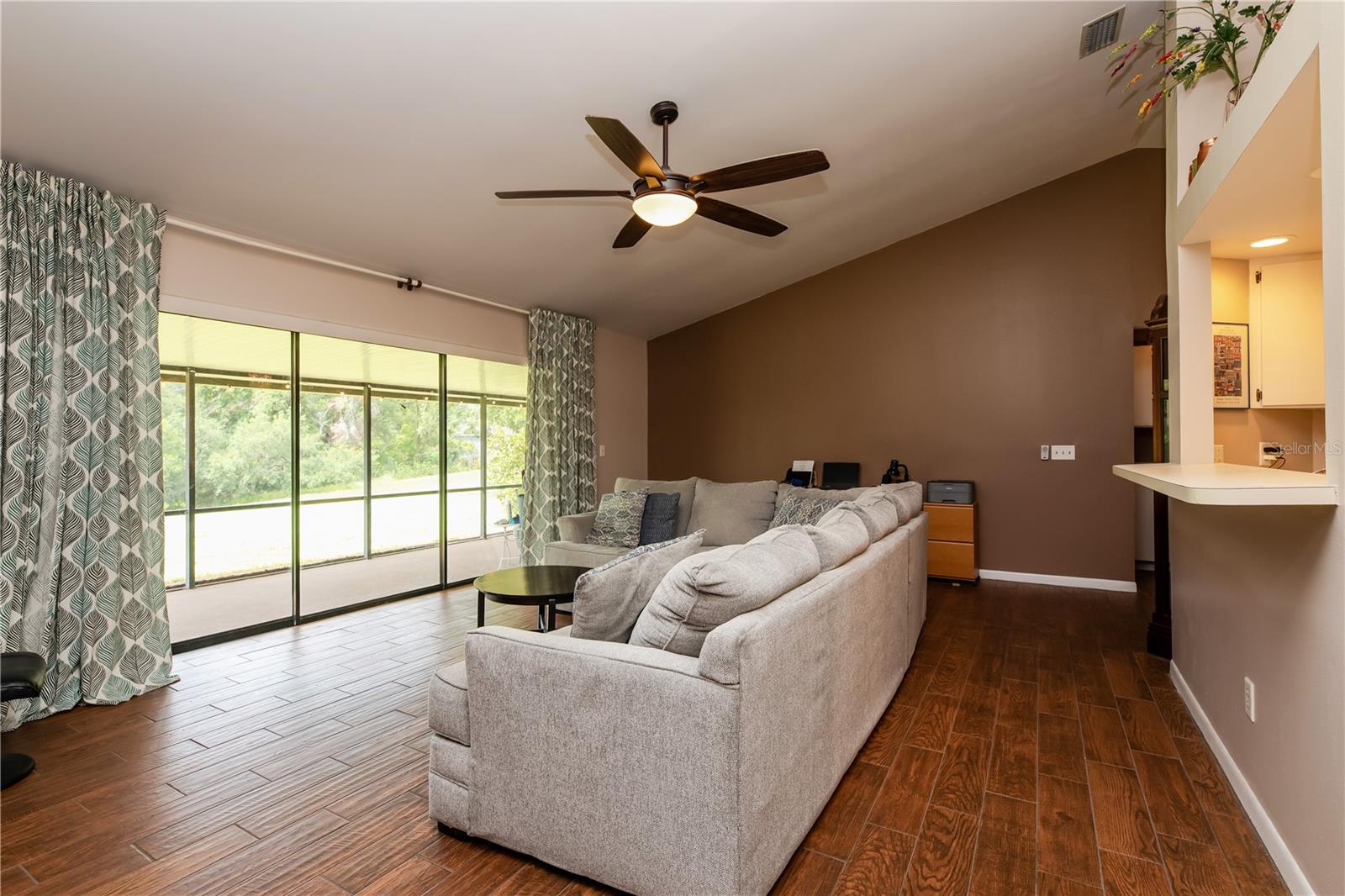 Open Living Space with panoramic views of pond and large backyard