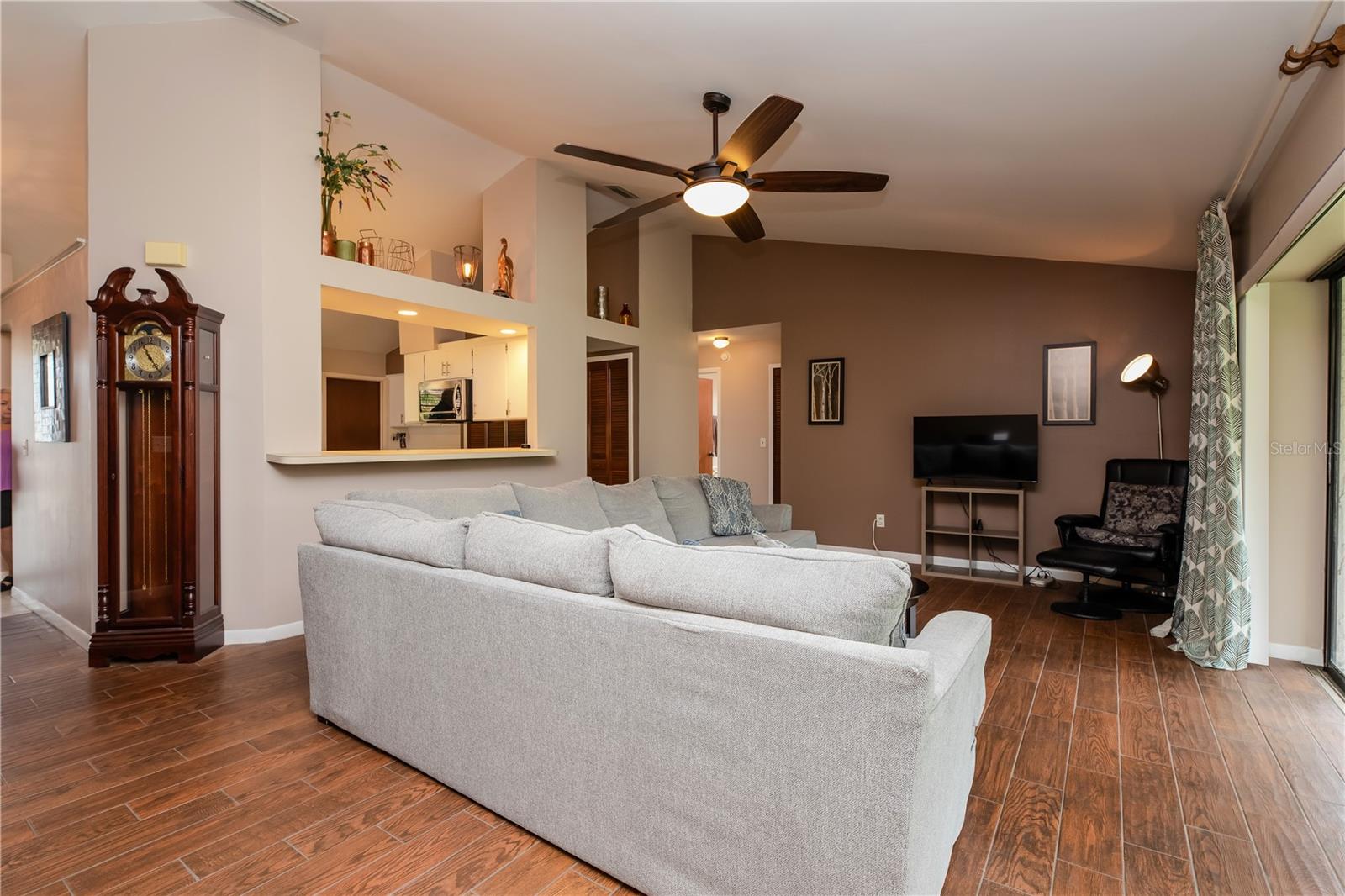 Open Living Space with panoramic views of pond and large backyard