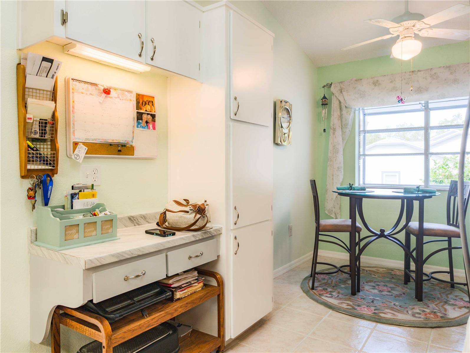 Kitchen with built in desk and pantry
