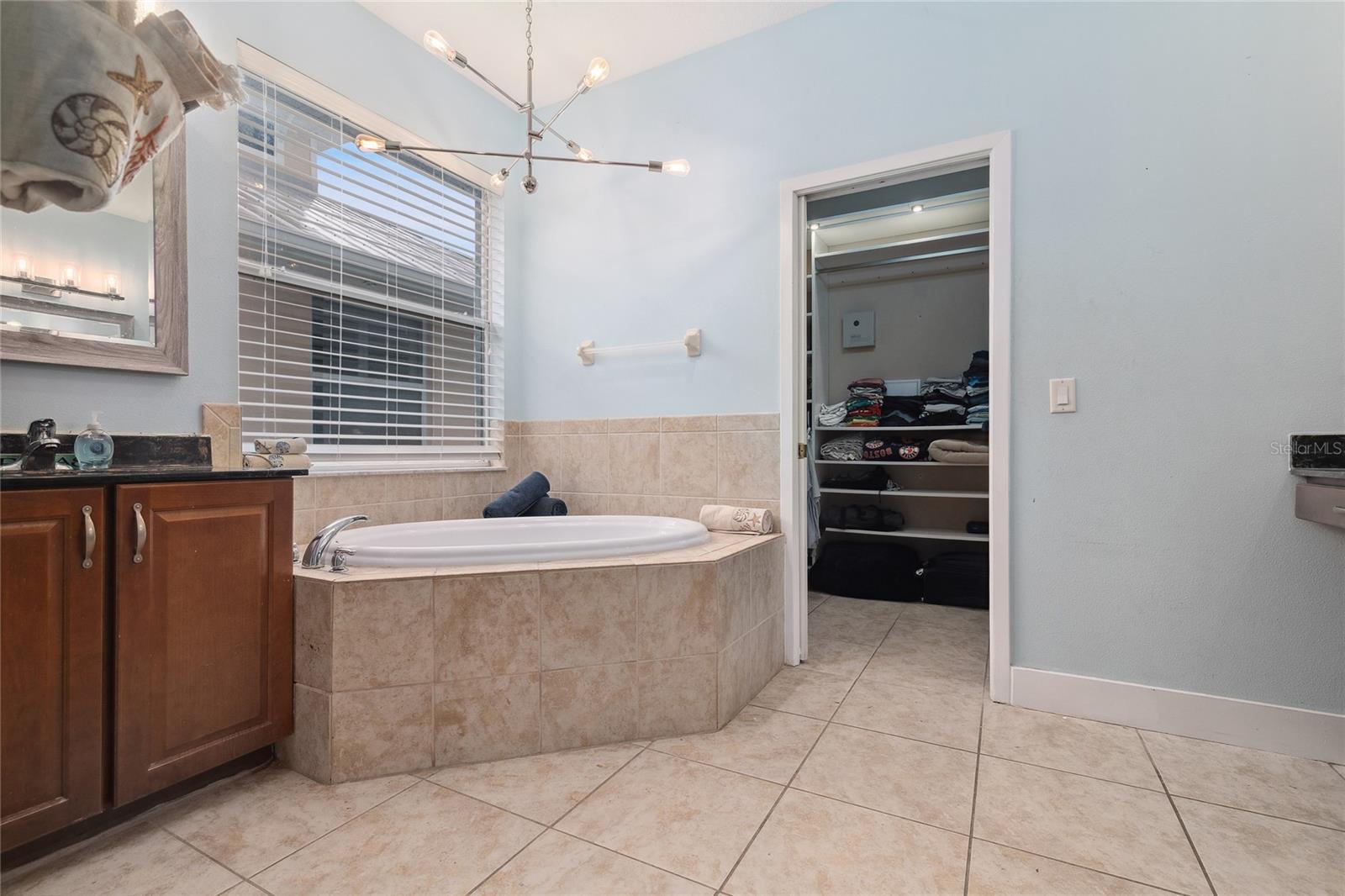 Primary Bathroom with jetted tub and double vanities .