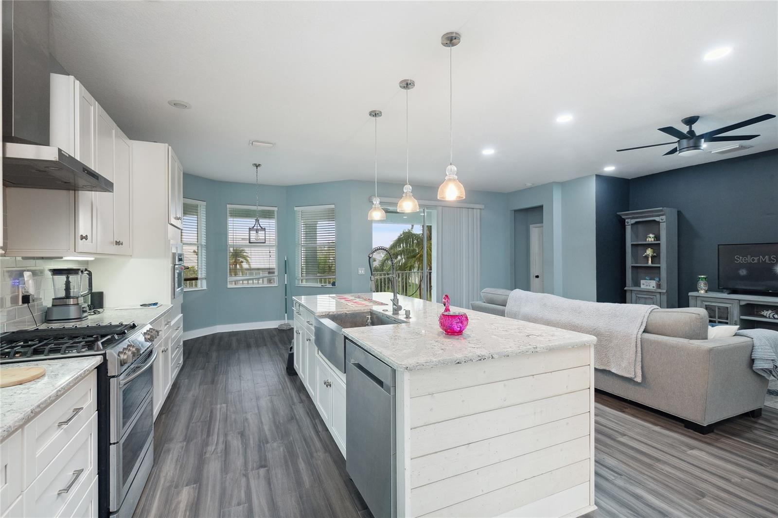 Kitchen with a scenic view and direct access to a spacious outdoor balcony.