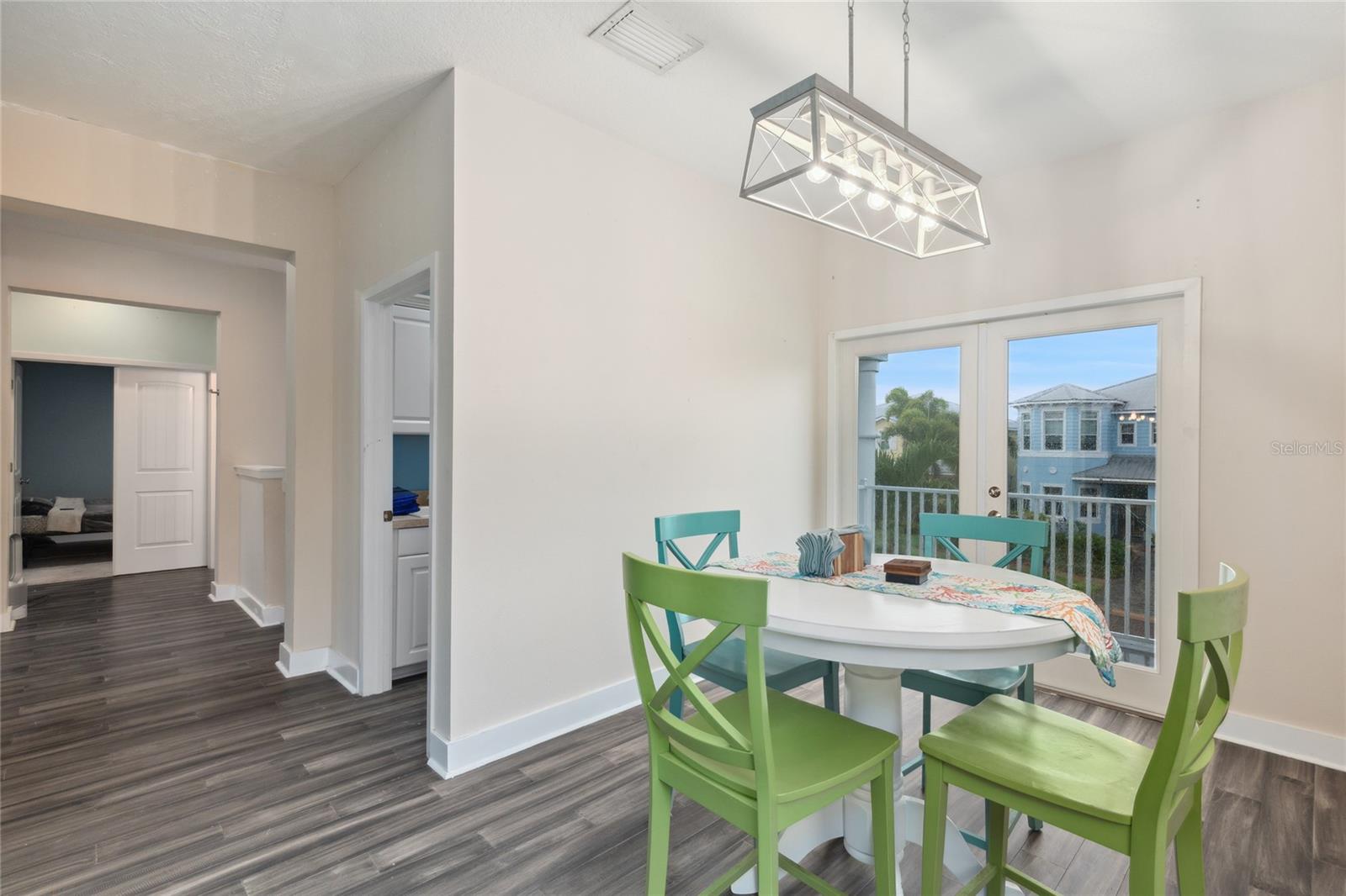 Dinning Room featuring patio doors, designed to create  a breezy, open air flow.