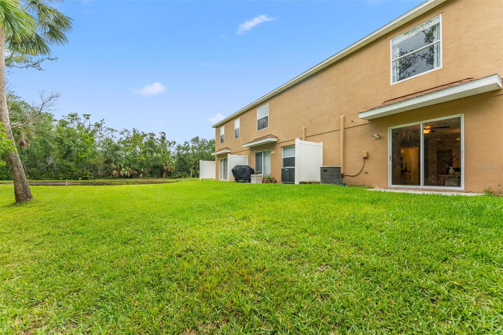 Lush grass and Conservation right outside your back door! Privacy fences separate each unit's back patio space. You can potentially screen your back patio as well.