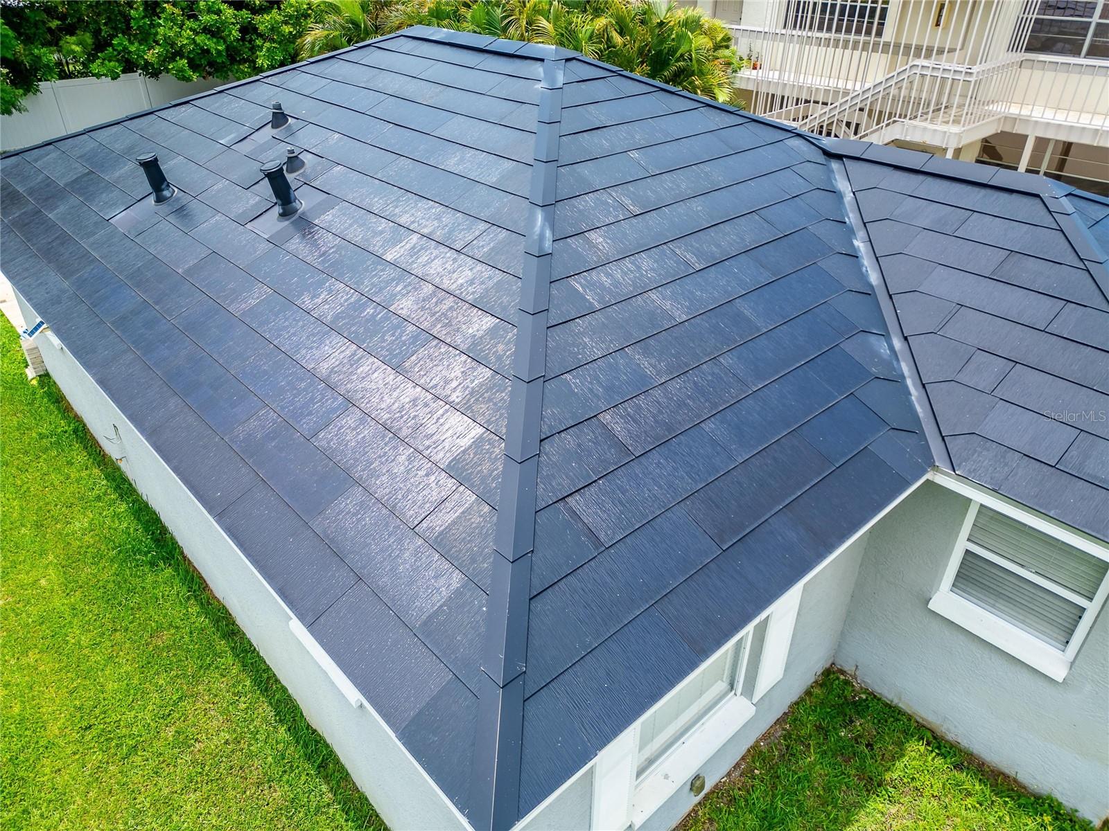 state-of-the-art Tesla Solar Roof system, complete with Powerwall backup batteries and off-grid capability