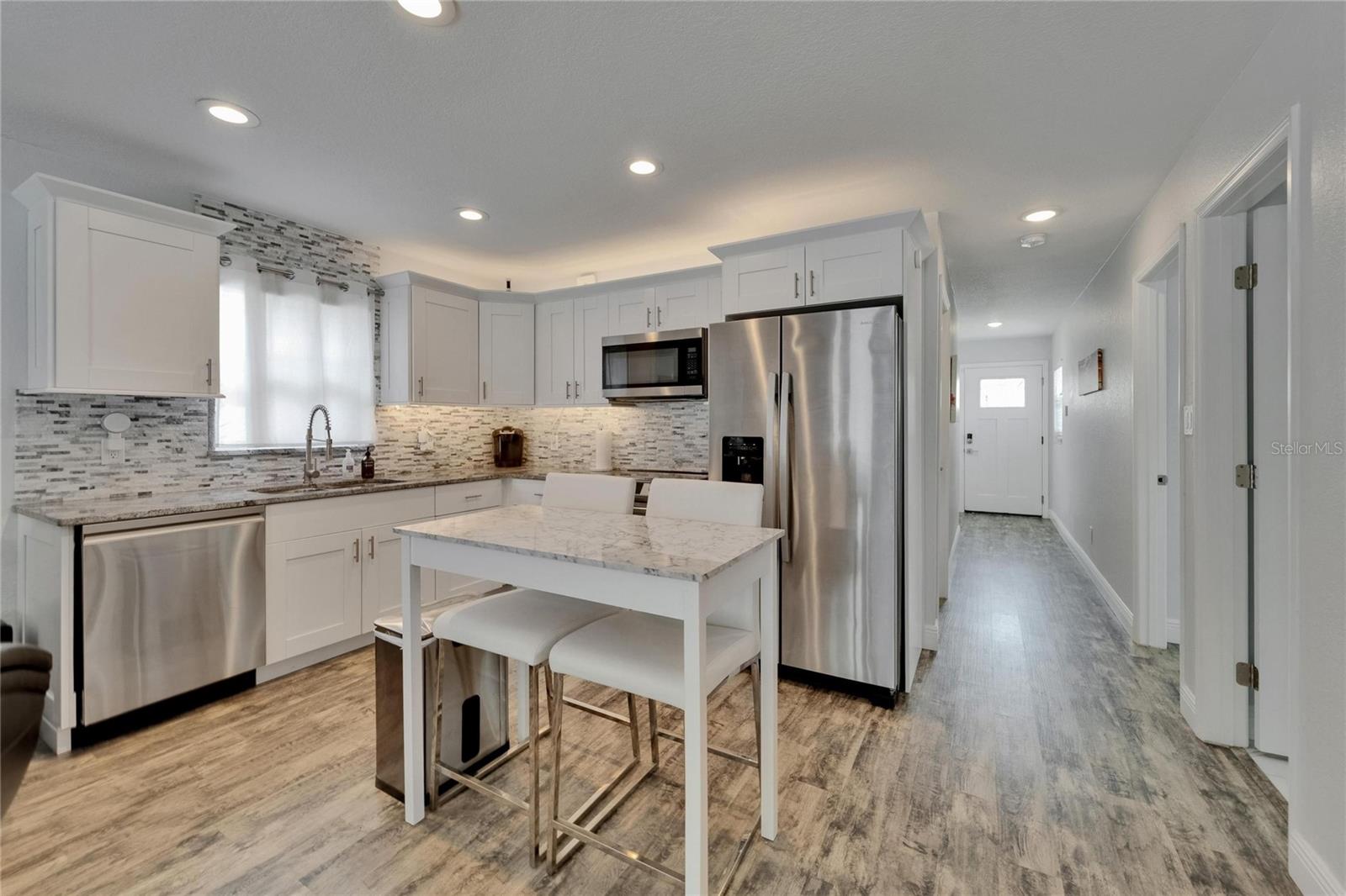 The kitchen is a chef’s delight with granite countertops, stainless steel appliances