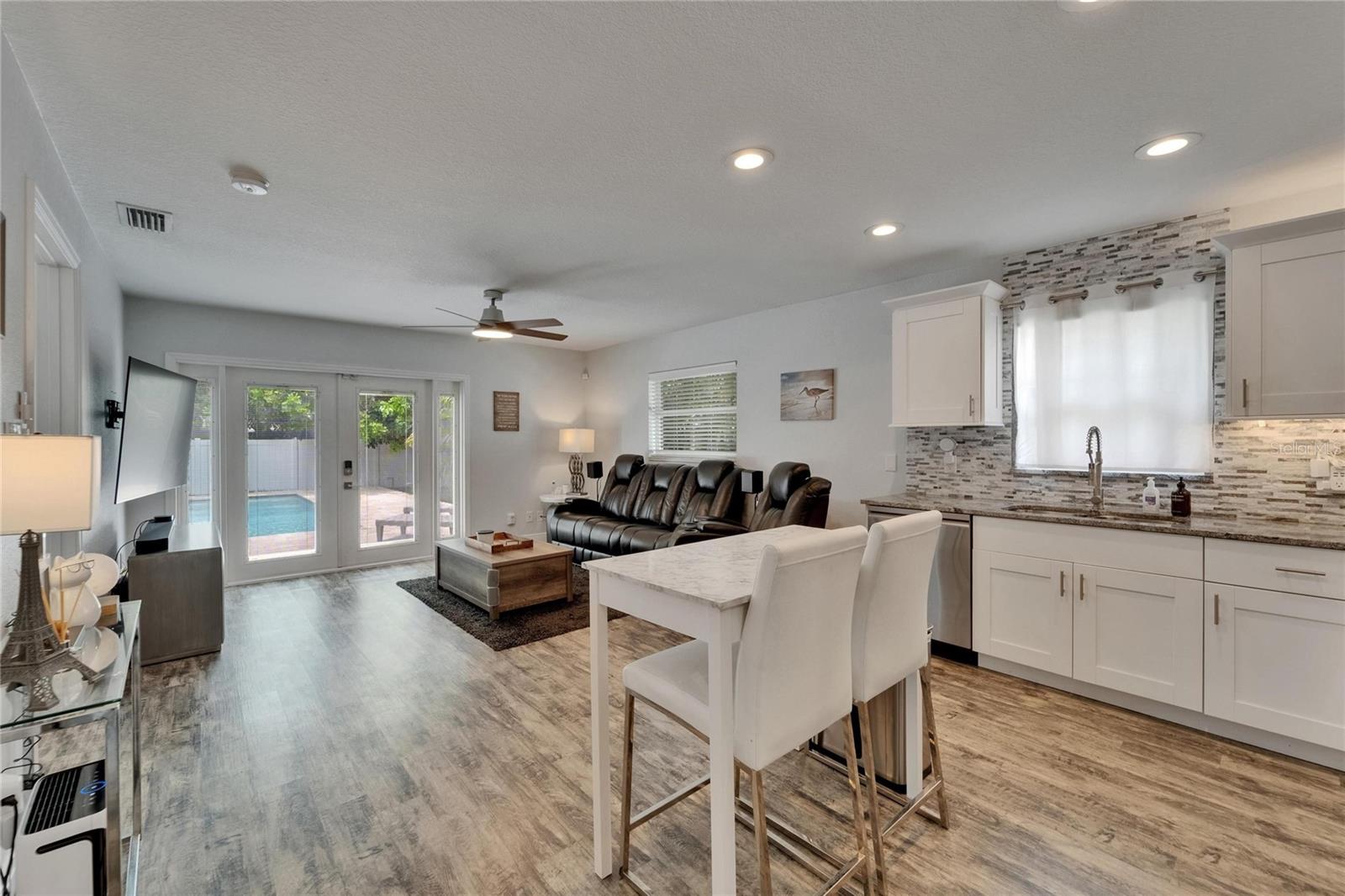 seamless flow into the spacious living room—ideal for movie nights, entertaining, or just relaxing after a pool day.
