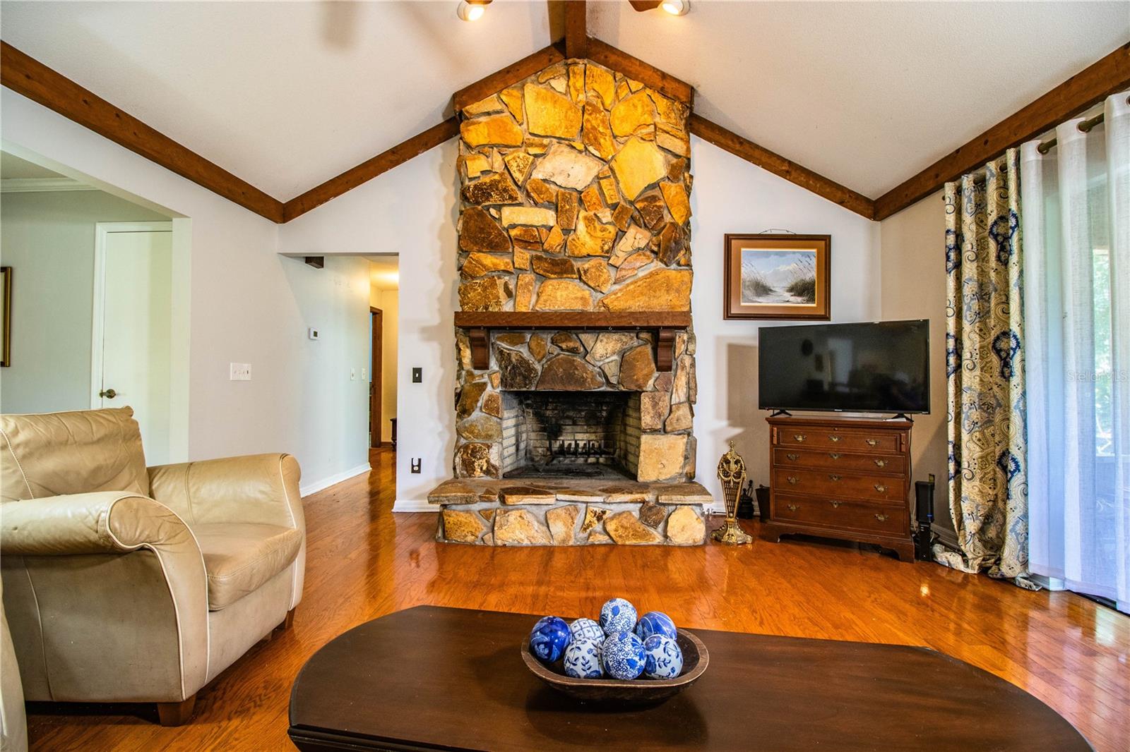 The family room features a cozy fireplace and warm wood accents for a welcoming feel.