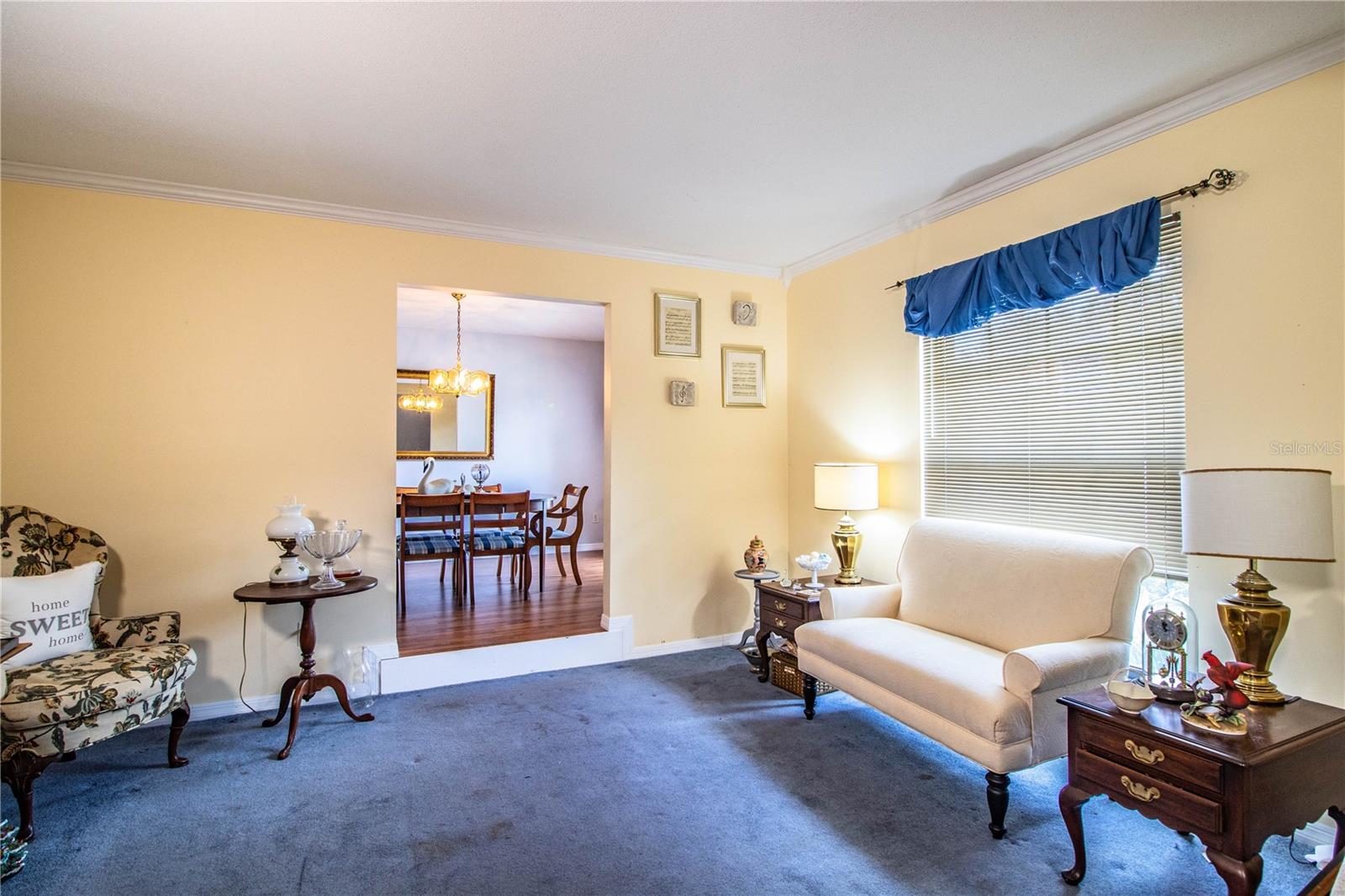 Cozy sunken living room offers a relaxed space perfect for movie nights or quiet lounging.