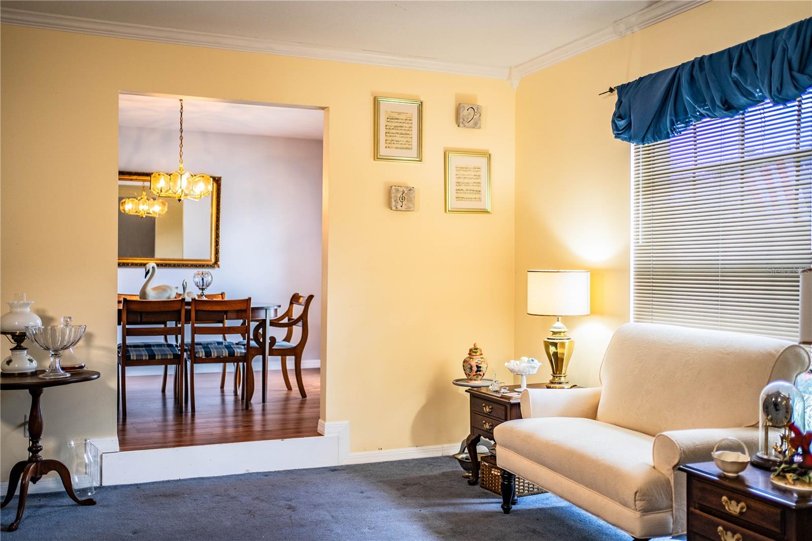 Step down into a spacious living room/den ideal for flexible living or entertaining.